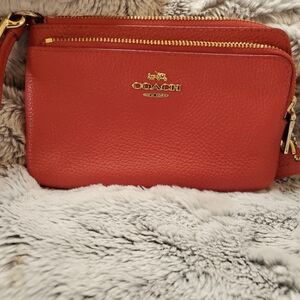 Coach Red Wristlet 6in X 4in X 3 in! Perfect for the holidays as a gift or party
